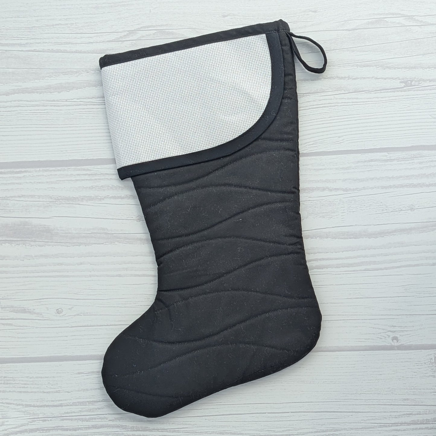 black Christmas stocking with blank cross stitch cuff