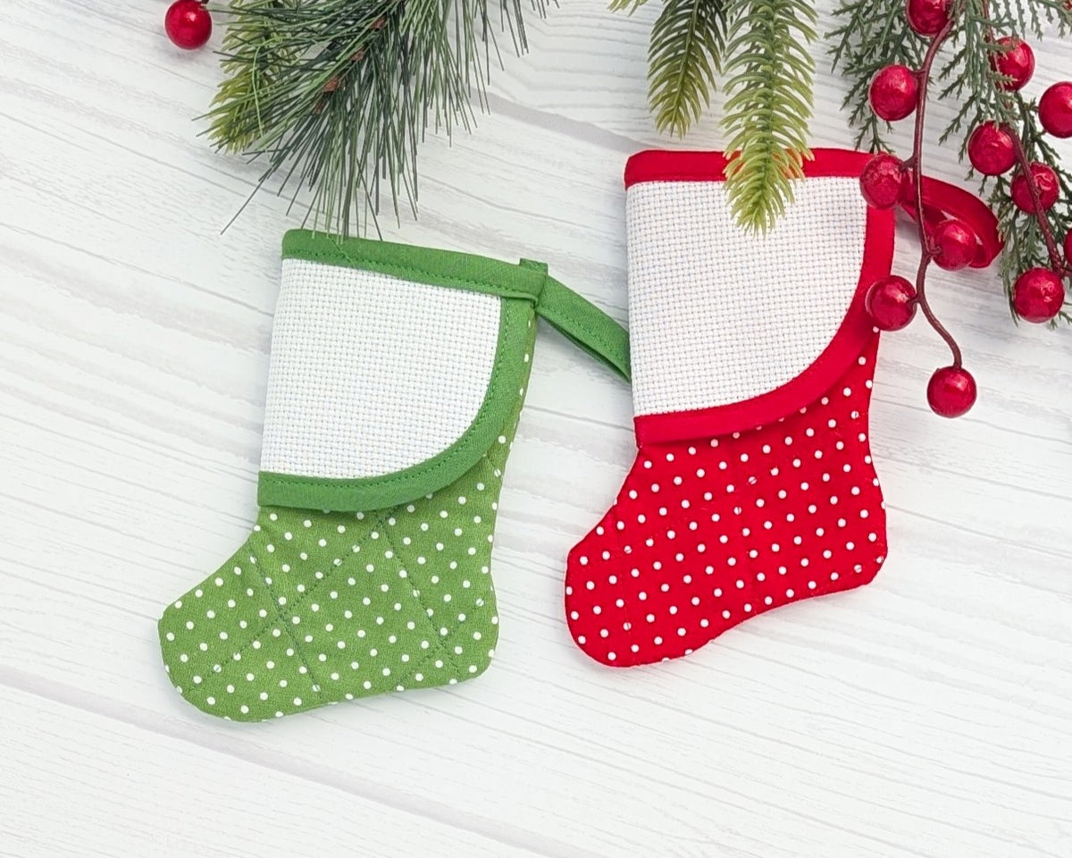 red or green mini christmas stocking with blank cross-stitchable cuff