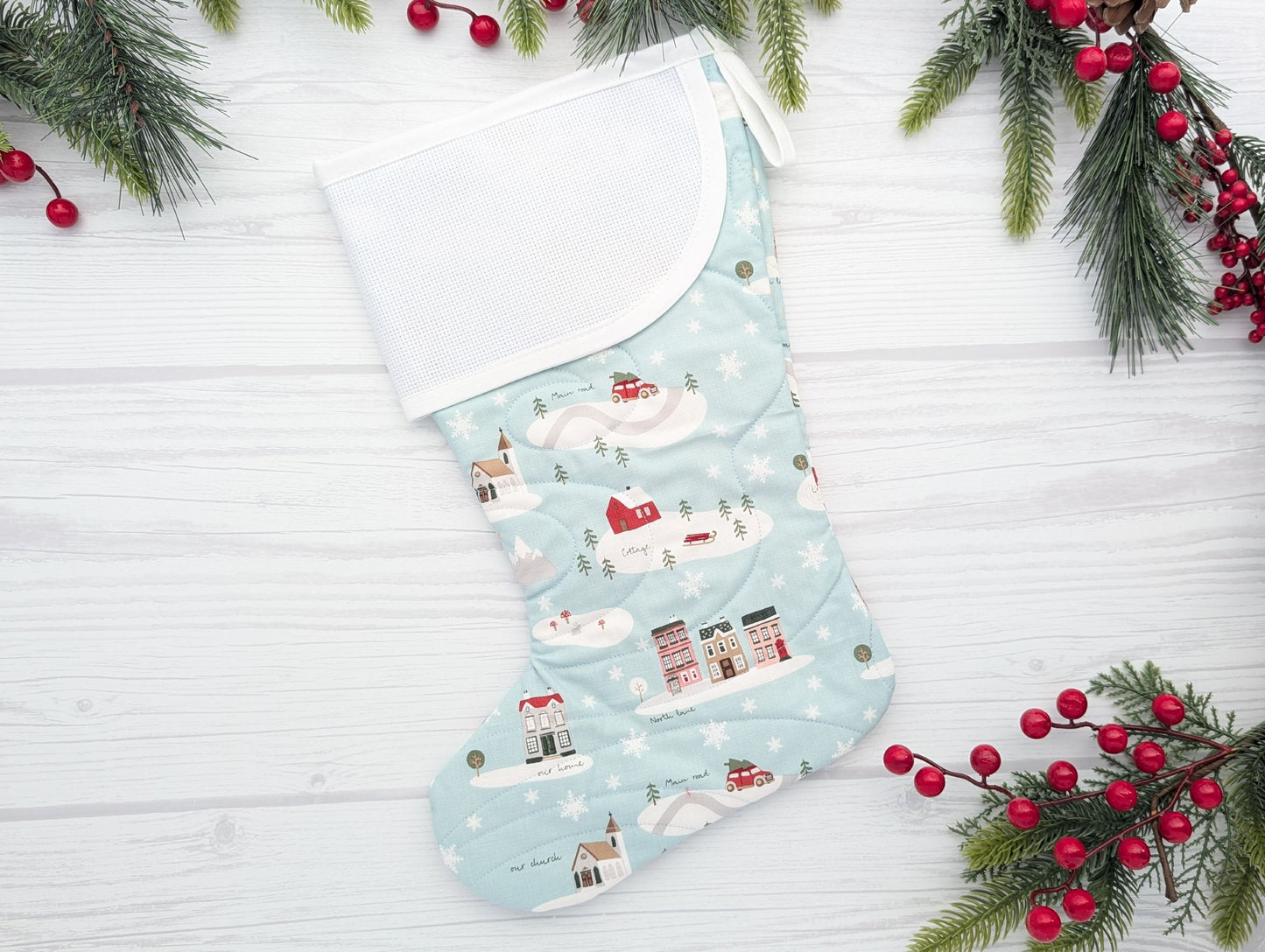 aqua village quilted Christmas stocking with blank cross stitch cuff