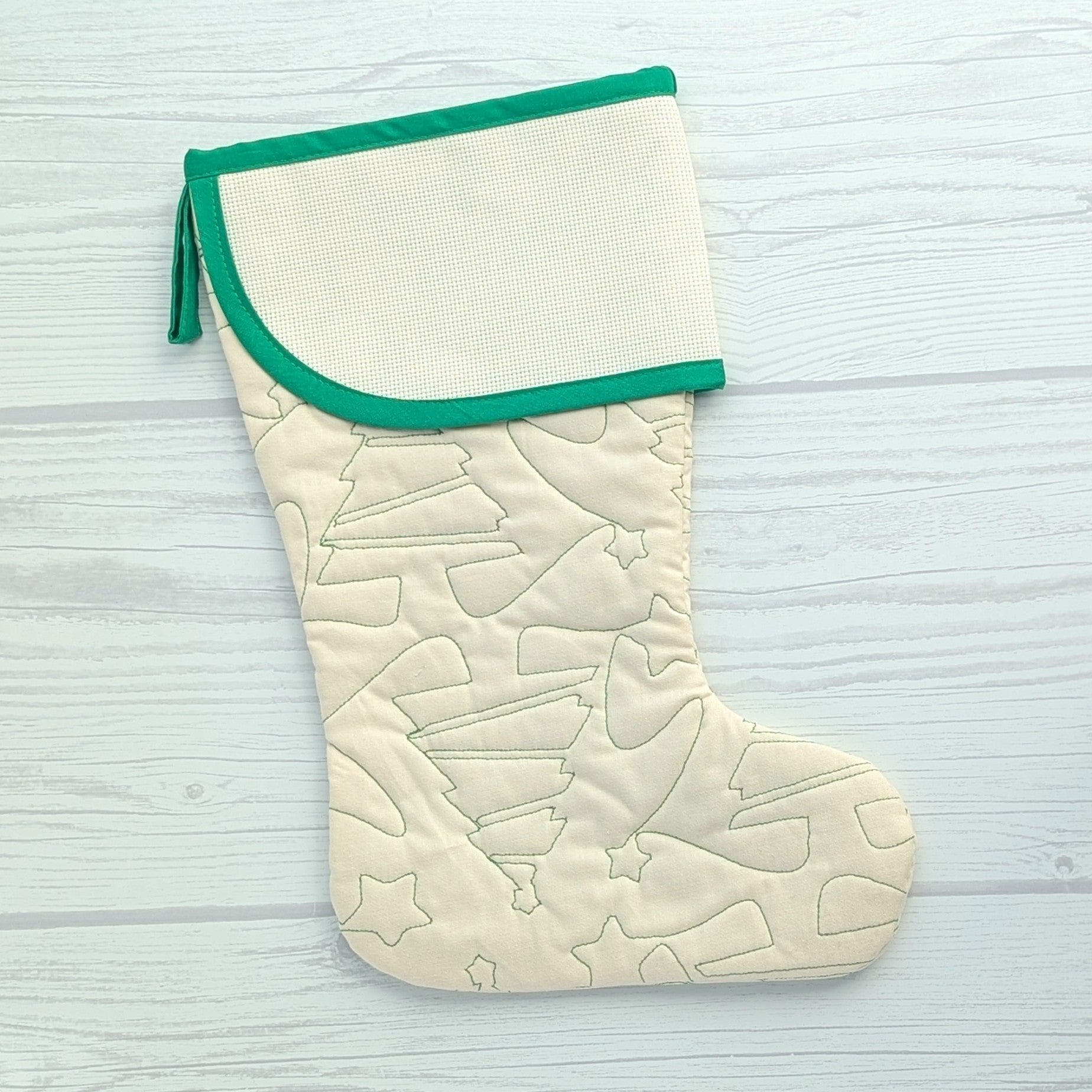 Cream Christmas stocking with green trim and blank cross stitch cuff