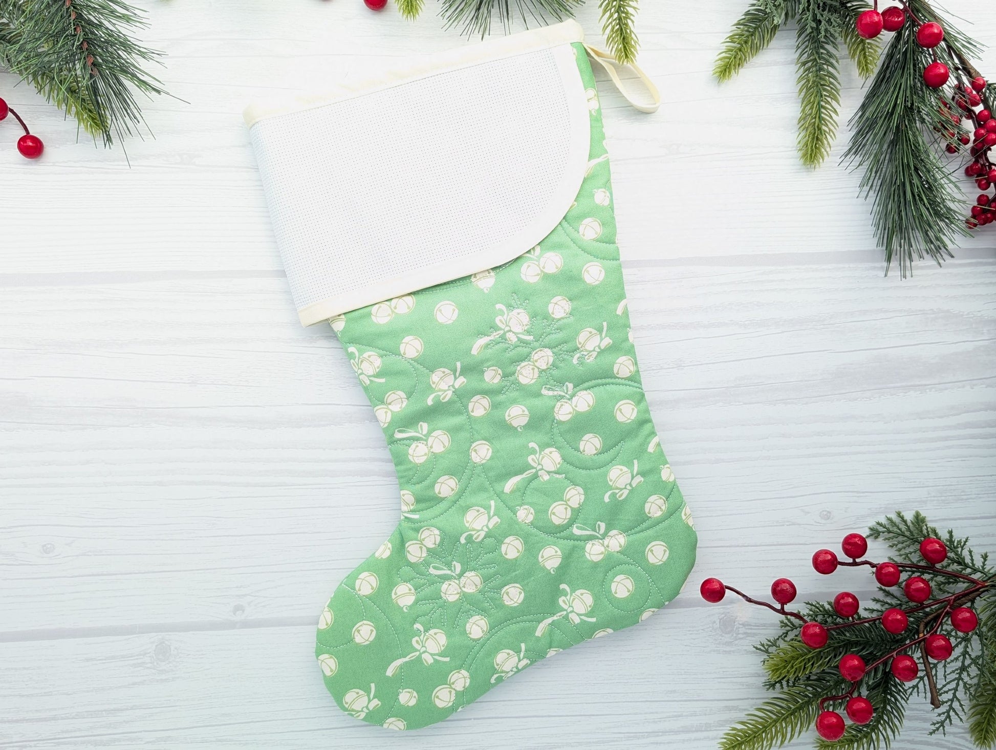 green jingle bells quilted Christmas stocking for musician with blank aida cross stitch cuff