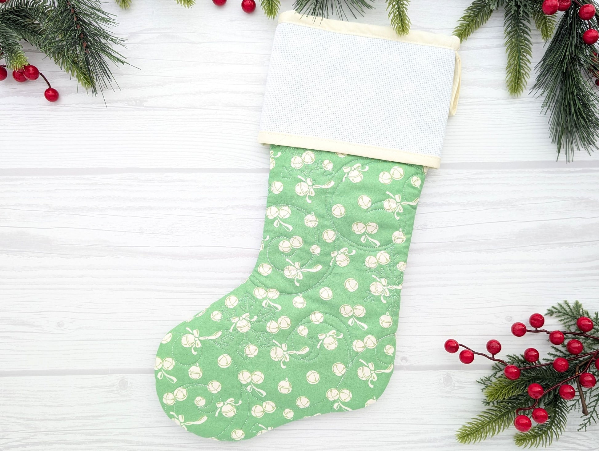 green jingle bells quilted Christmas stocking with blank cross stitch Aida cuff