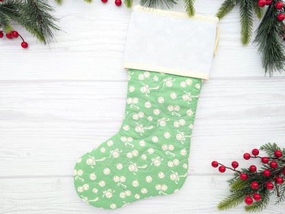 green jingle bells quilted Christmas stocking with blank cross stitch Aida cuff