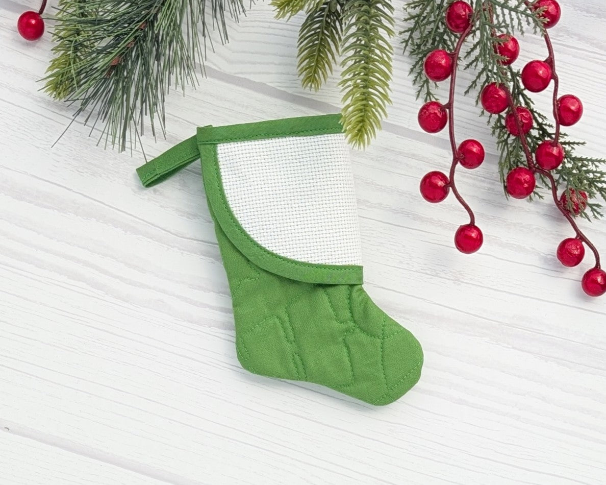 green curvy quilted mini christmas stocking with blank cross-stitchable cuff