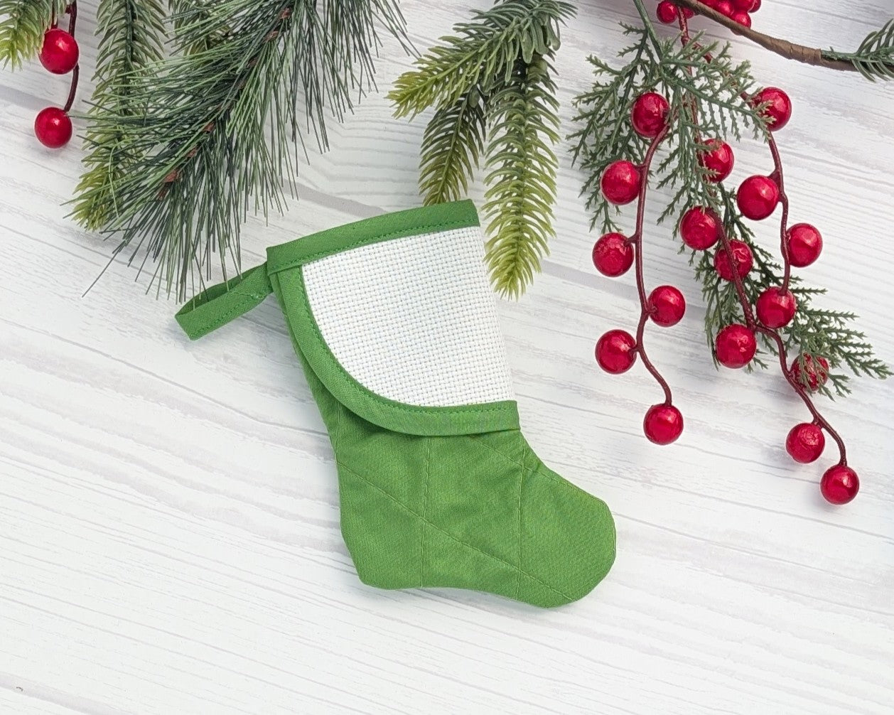 green straight quilted mini christmas stocking with blank cross-stitchable cuff