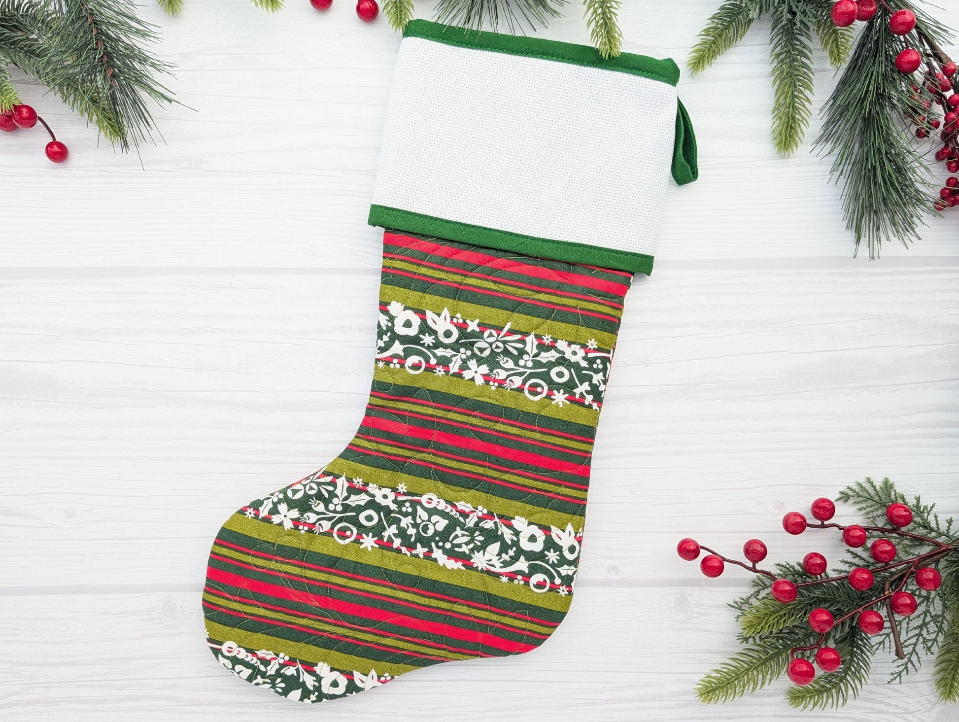 green stripe quilted Christmas stocking with blank cross stitch Aida cuff
