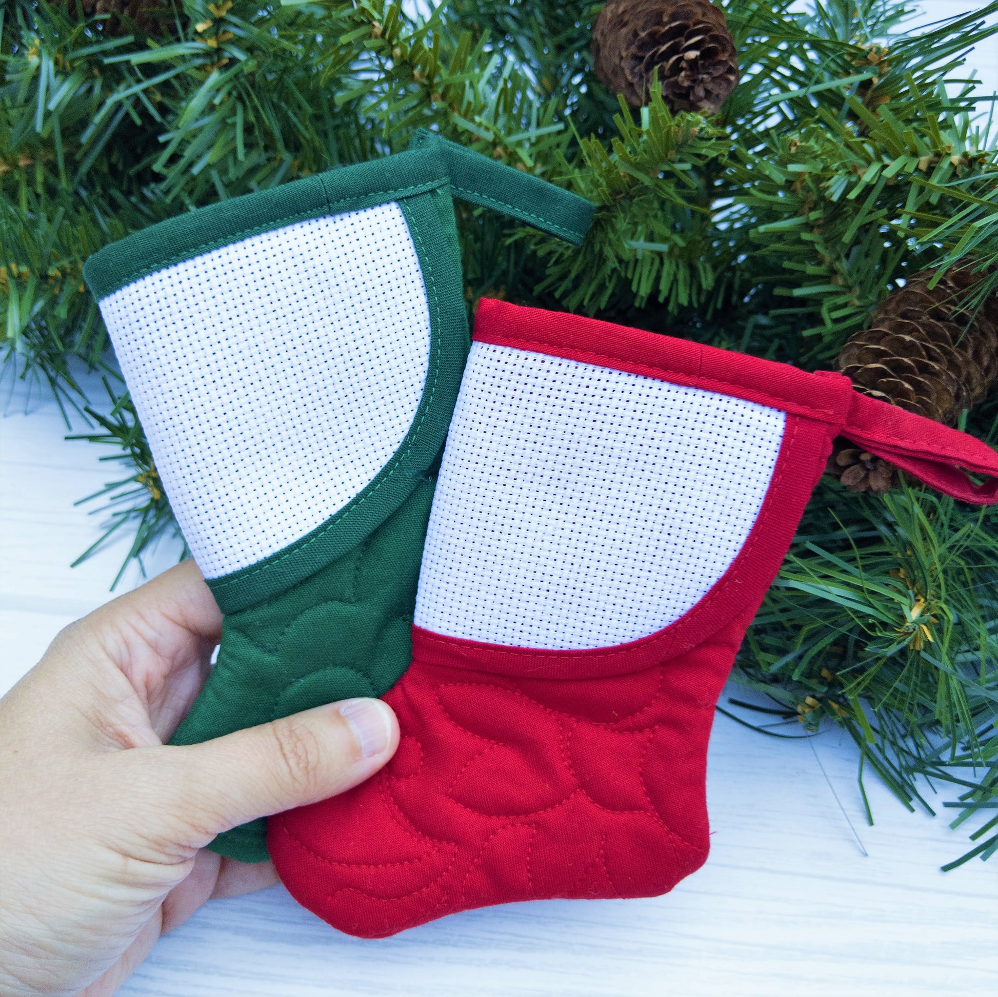 mini christmas stocking with blank cross-stitchable cuff two stockings in hand
