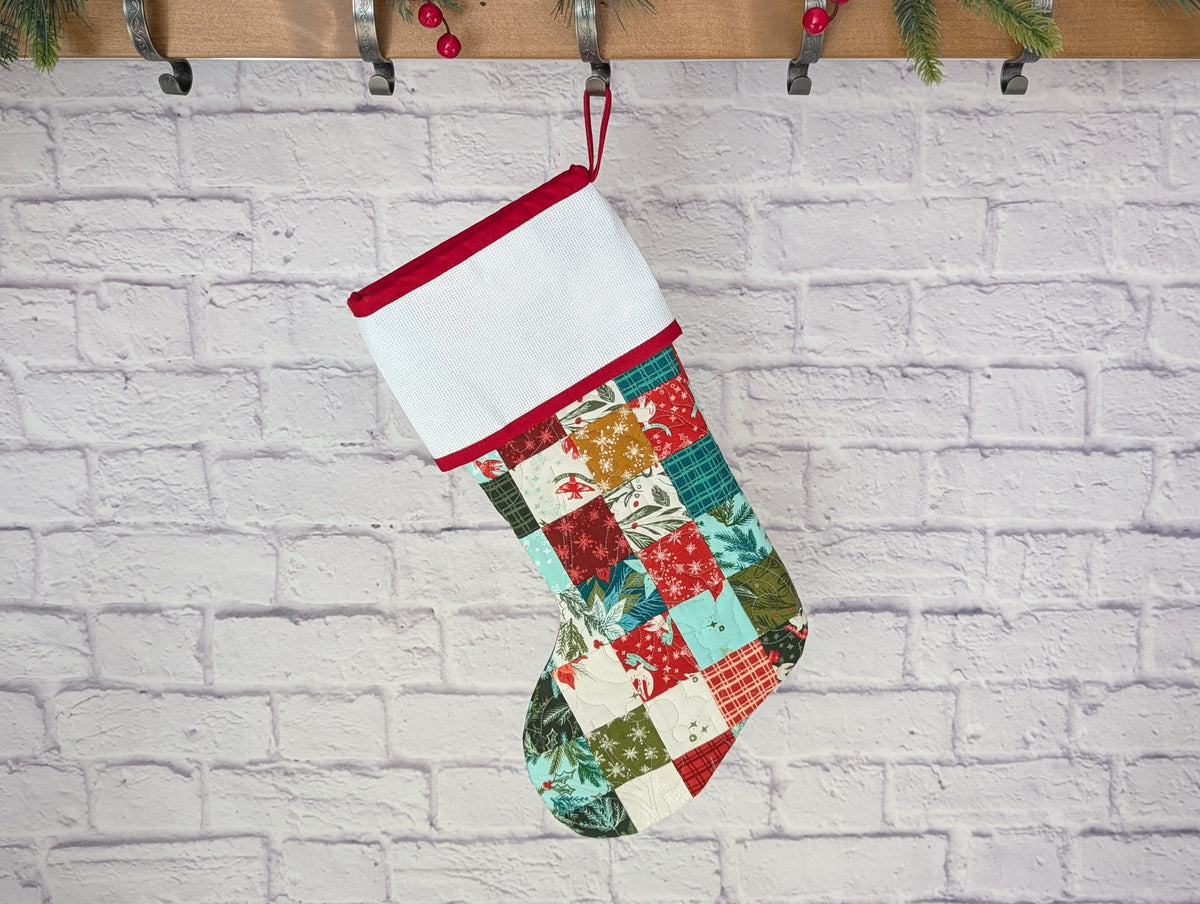 patchwork holiday stocking with blank cross stitch cuff