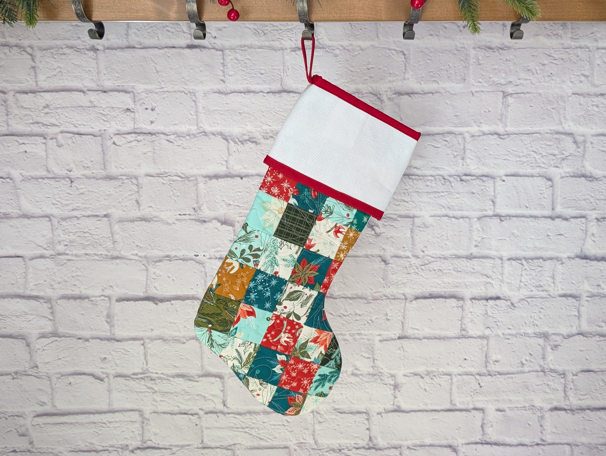 patchwork holiday stocking with blank cross stitch cuff