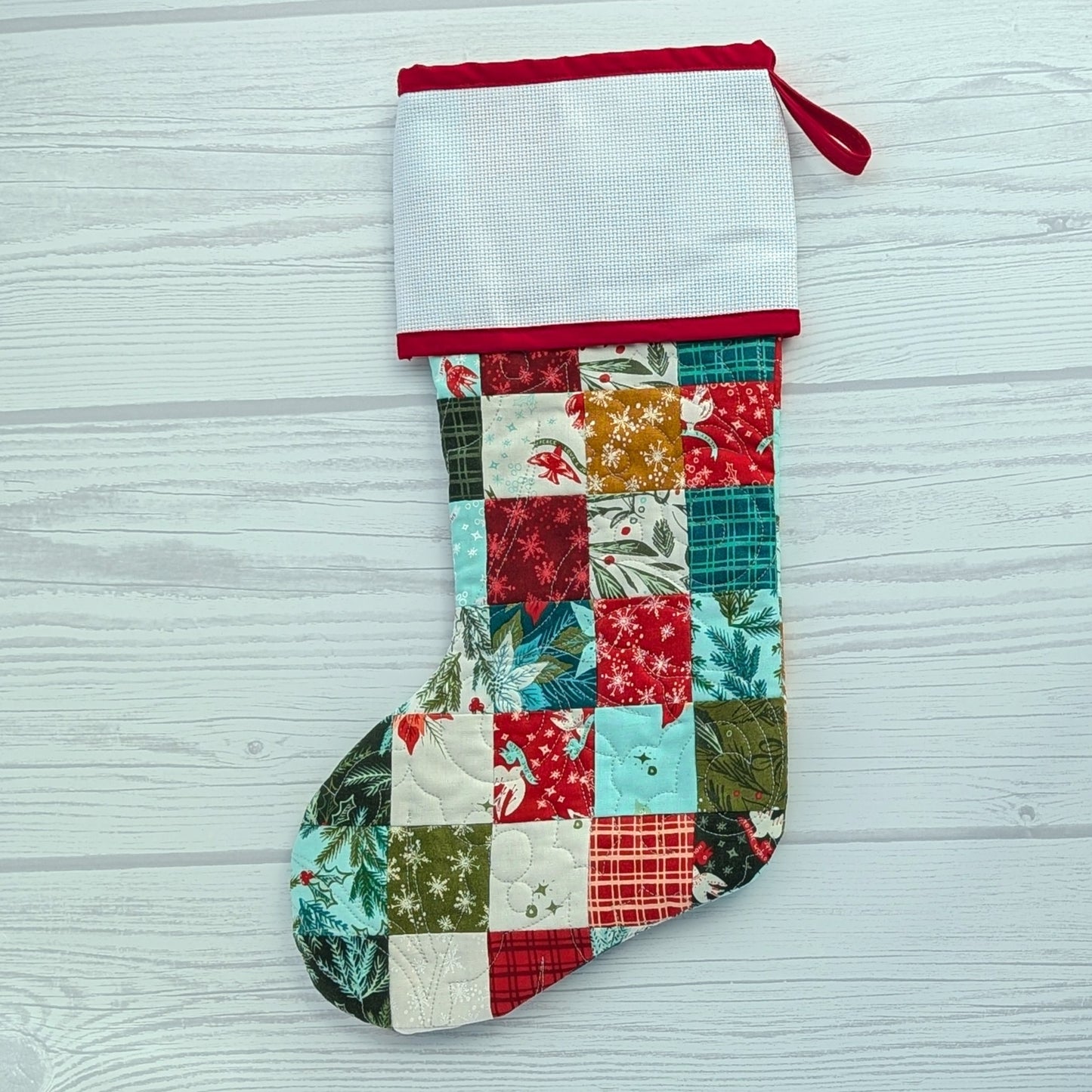 patchwork holiday stocking with blank cross stitch cuff