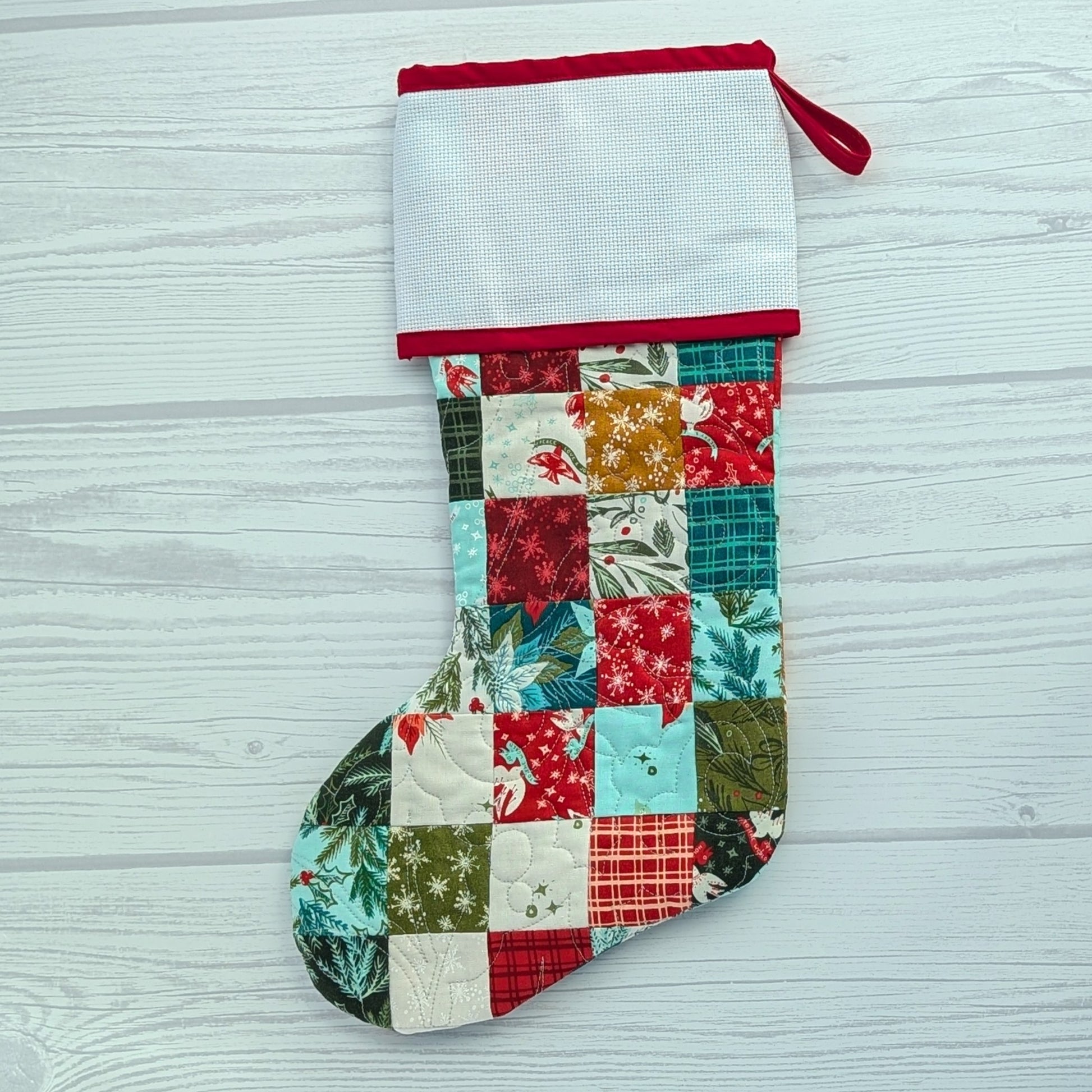 patchwork holiday stocking with blank cross stitch cuff