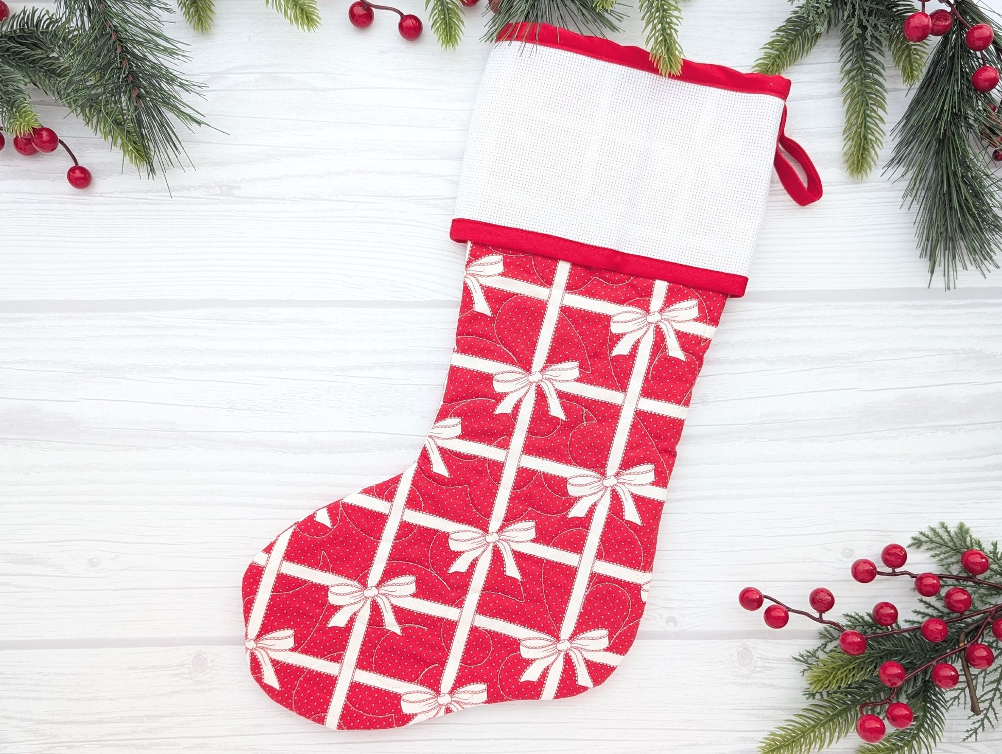 red bows quilted Christmas stocking with blank cross stitch Aida cuff