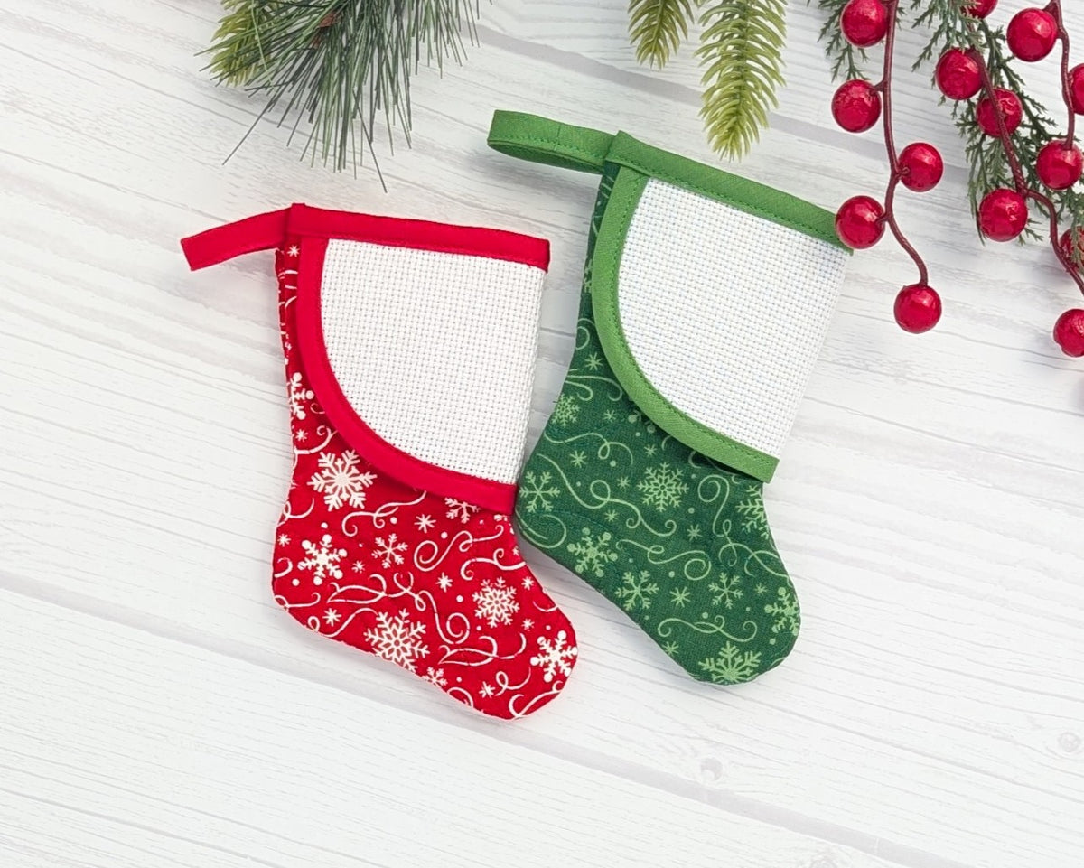 red or green snowflakes mini christmas stocking with blank cross-stitchable cuff