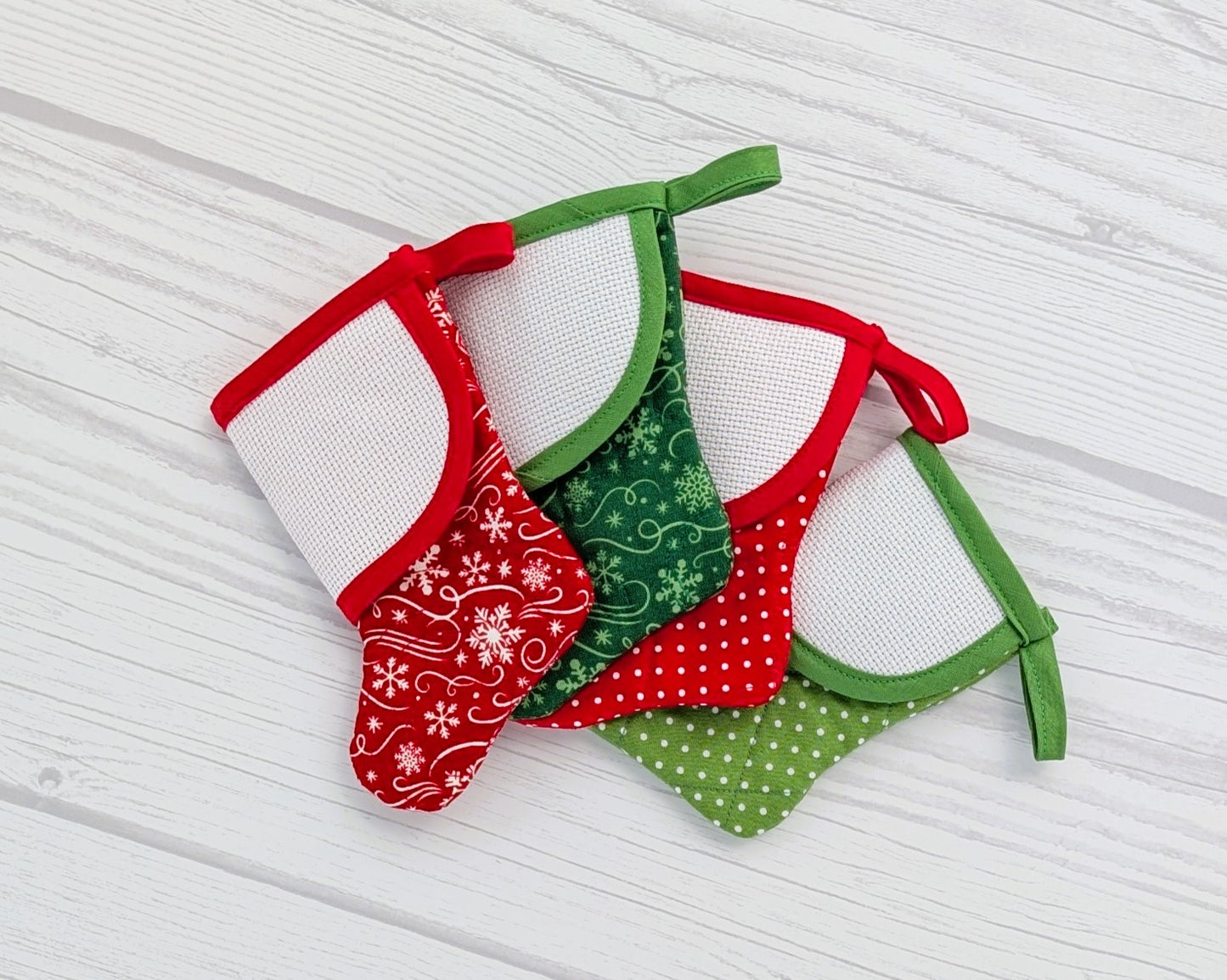 red and green mini christmas stocking with blank cross-stitchable cuff