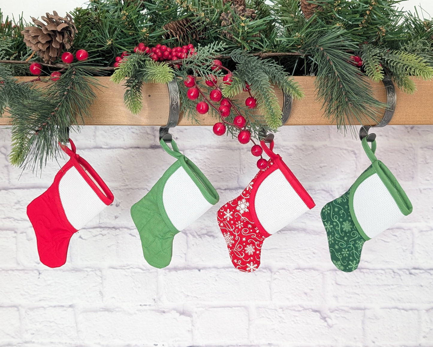 mini christmas stocking with blank cross-stitchable cuff hanging on mantle