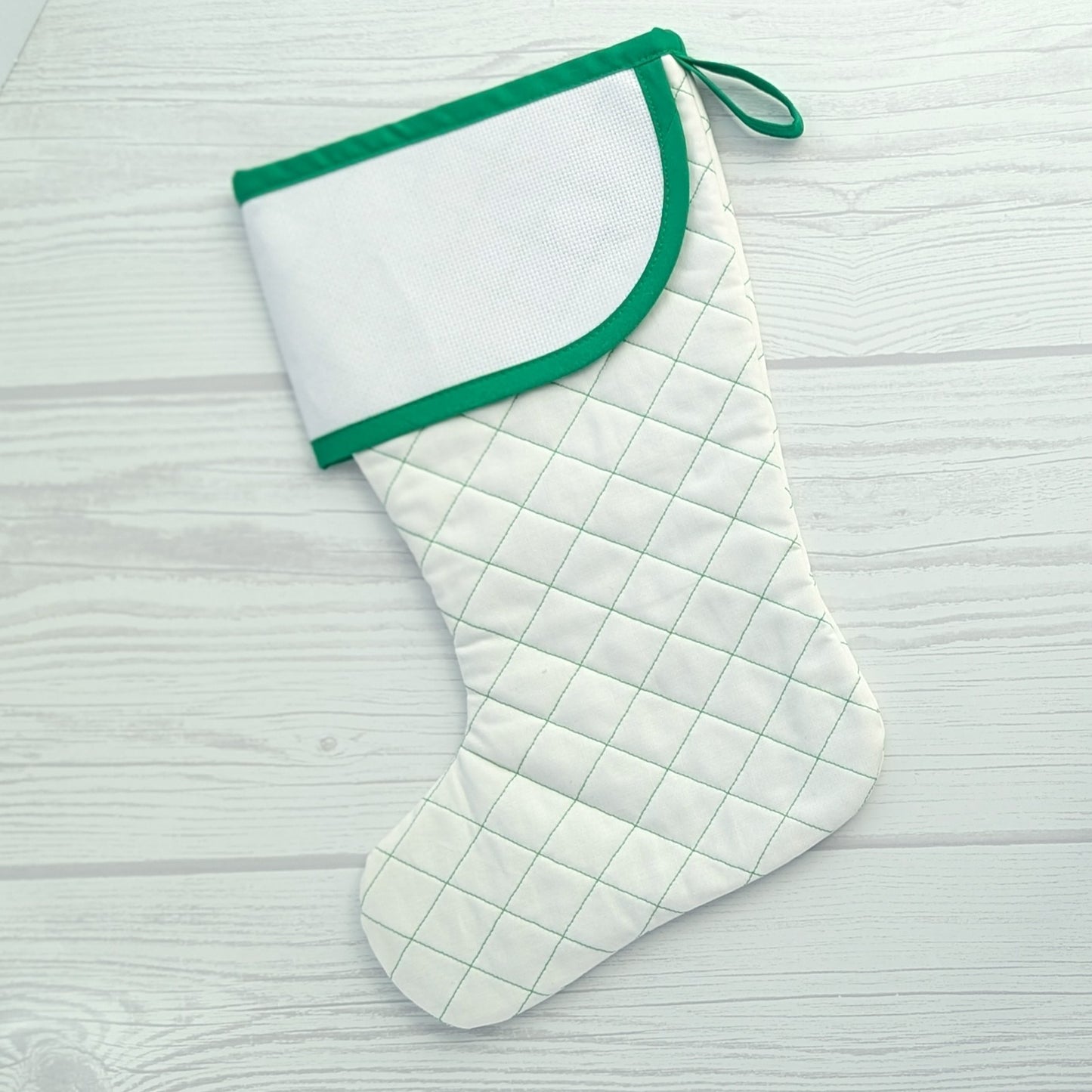 White Christmas stocking with green trim and traditional diamond quilting - cross stitch cuff
