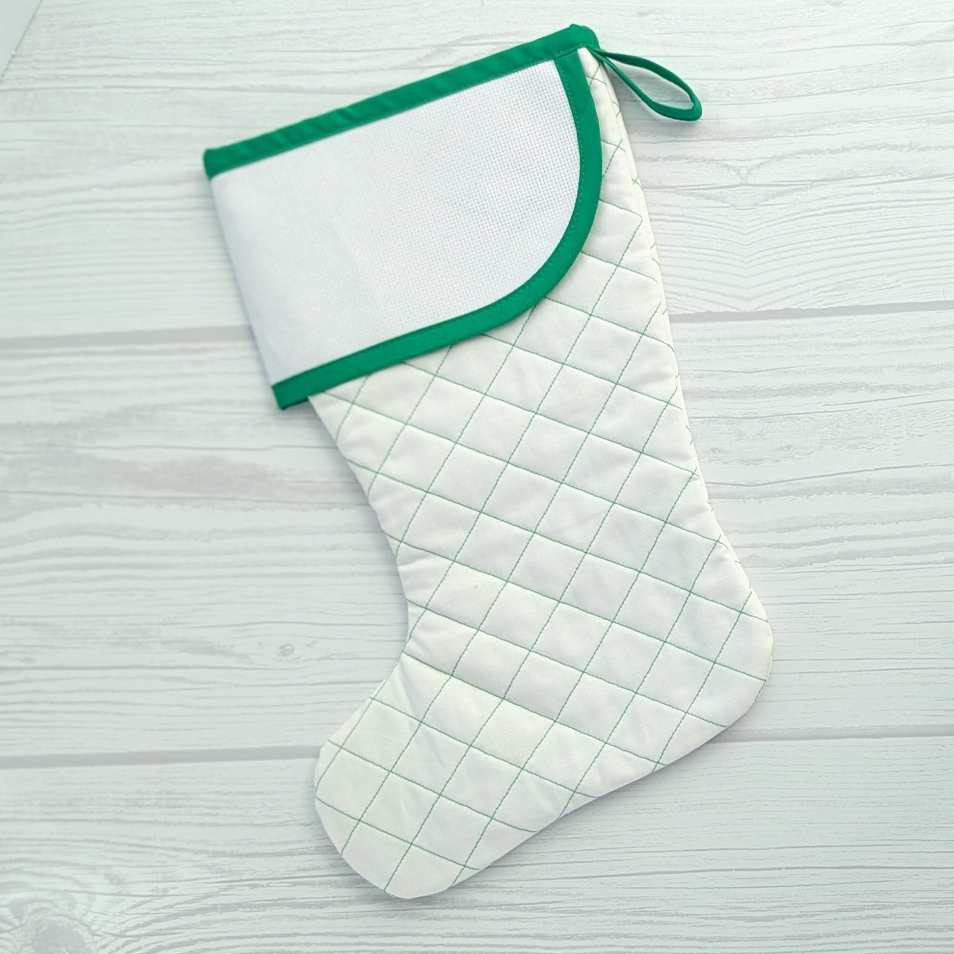 White Christmas stocking with green trim and traditional diamond quilting - cross stitch cuff