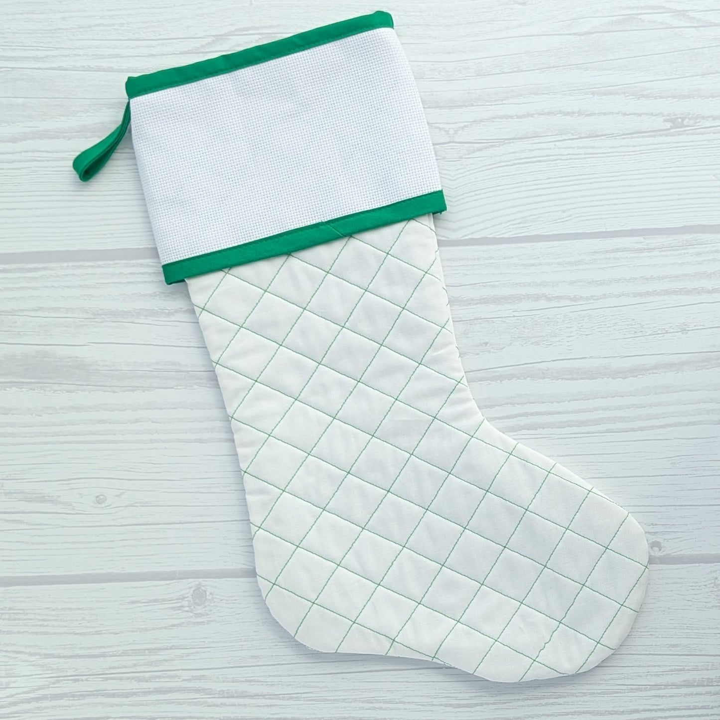 White Christmas stocking with green trim and traditional diamond quilting - cross stitch cuff