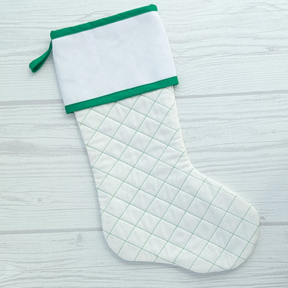 White Christmas stocking with green trim and traditional diamond quilting - cross stitch cuff