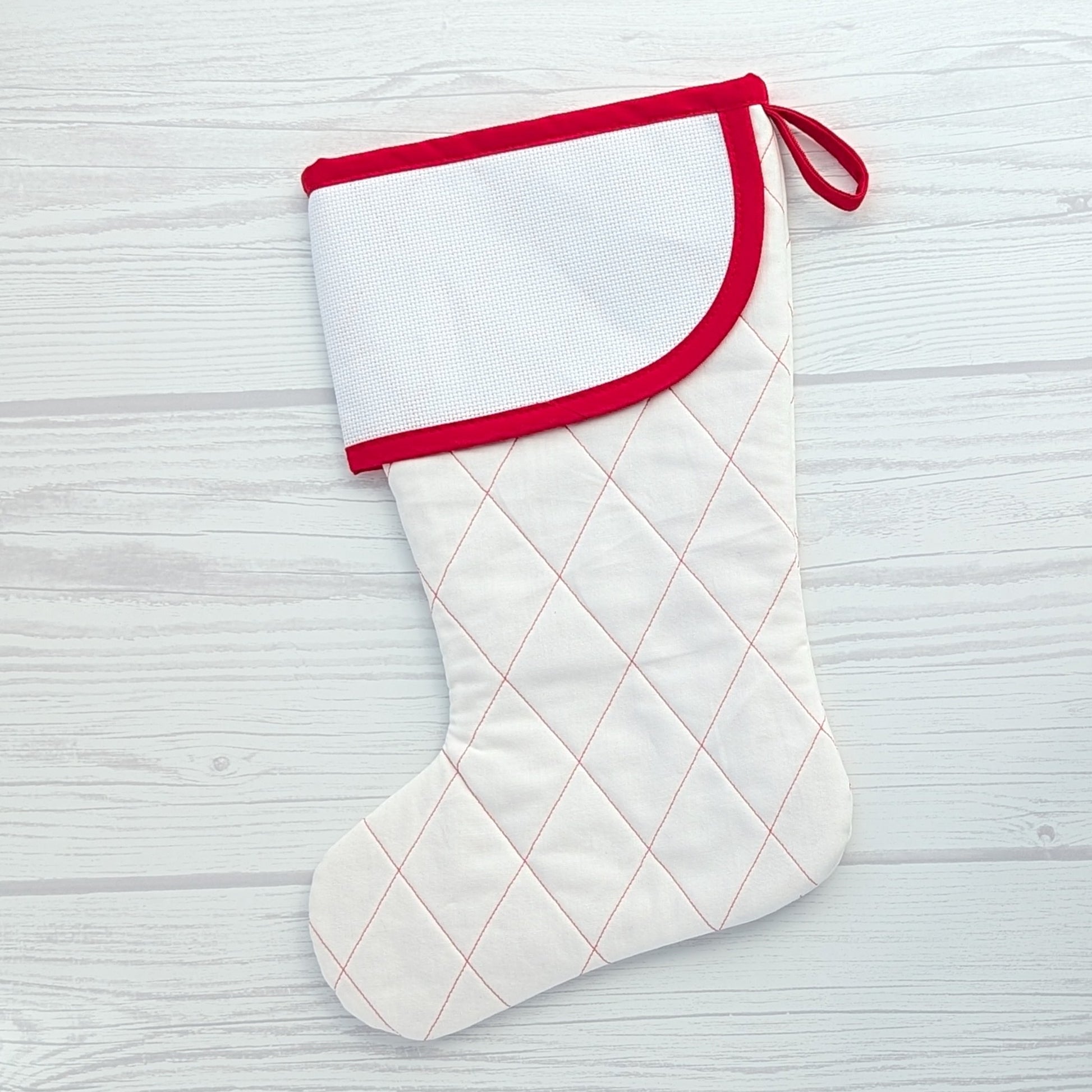 White Christmas stocking with red trim and traditional diamond quilting - cross stitch cuff