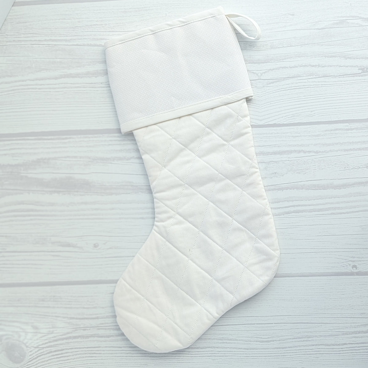 White Christmas stocking with white trim and traditional diamond quilting - cross stitch cuff